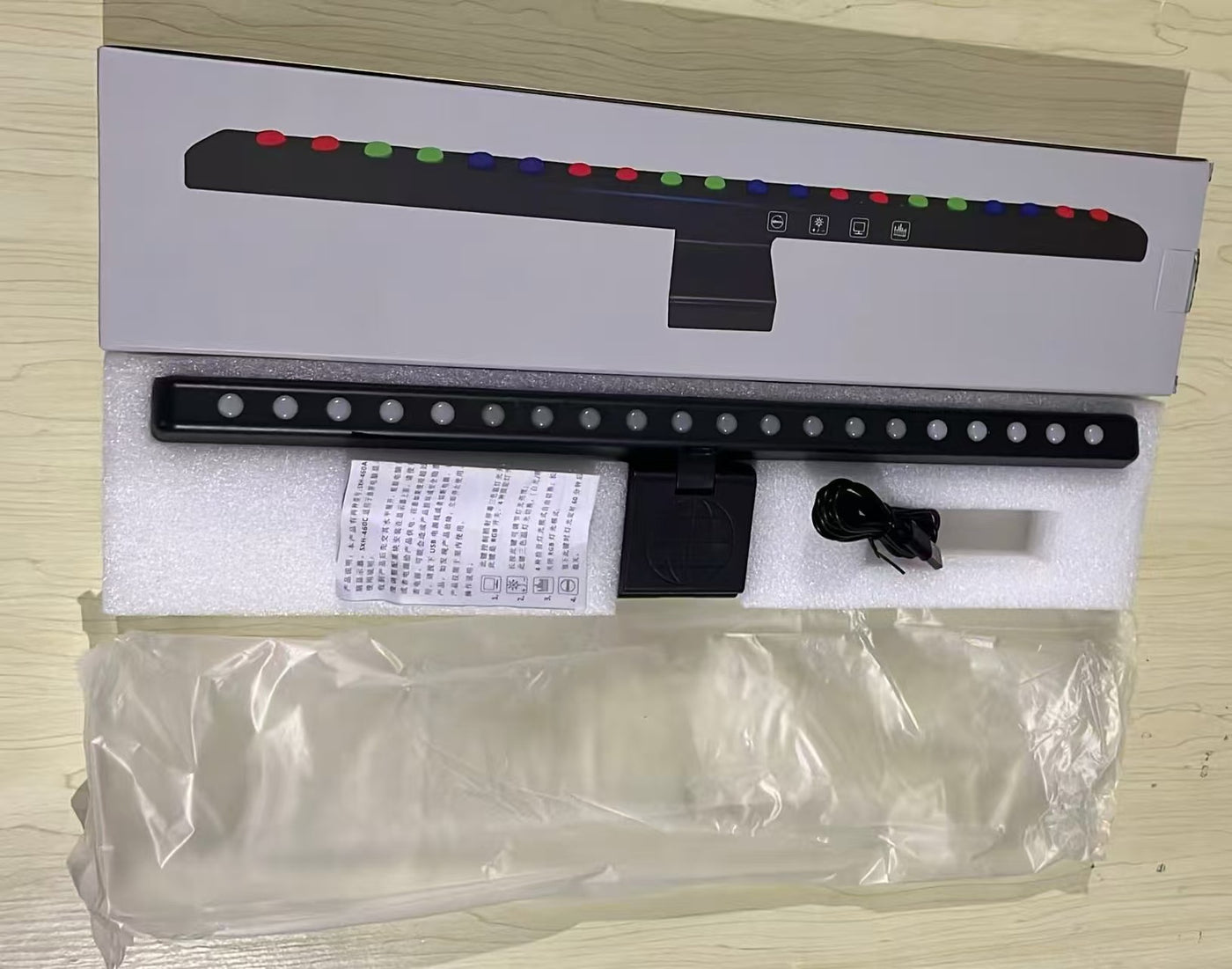 A hanging light on the computer monitor
