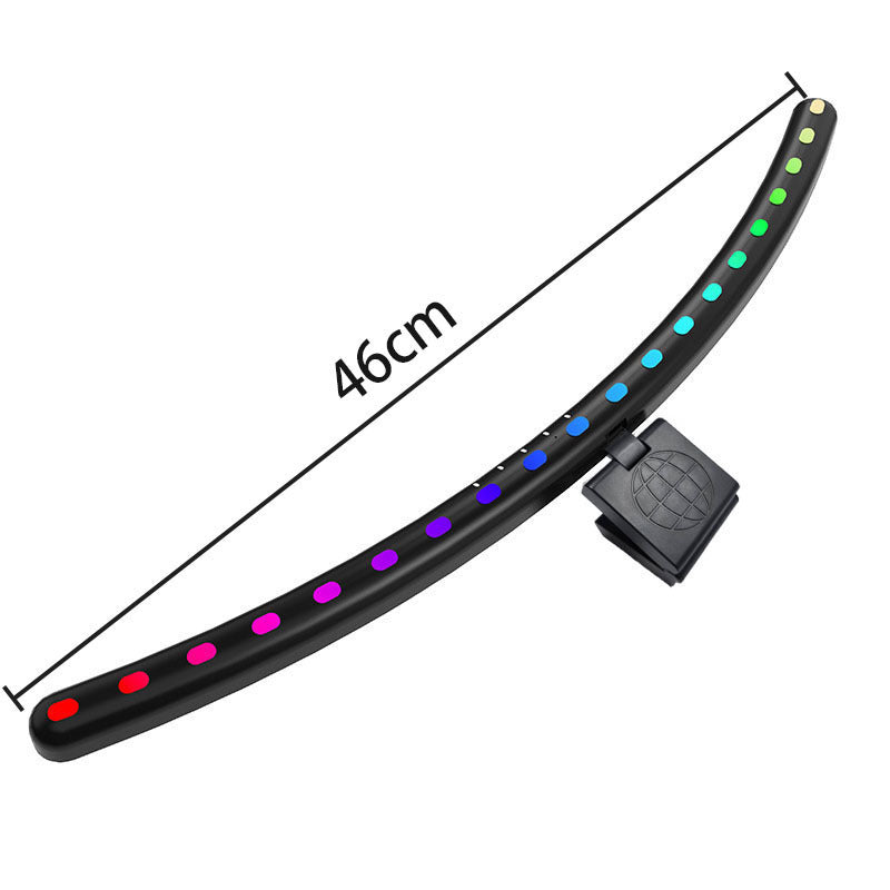 A hanging light on the computer monitor