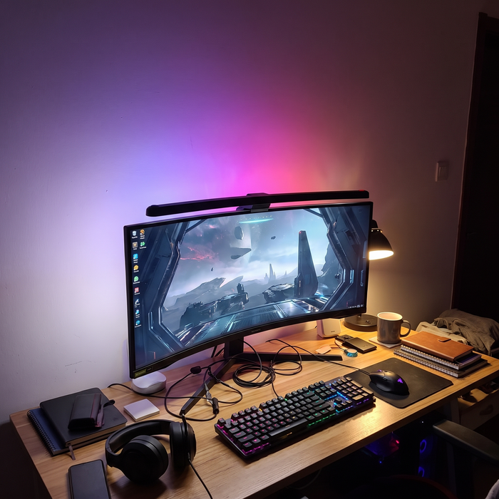 A hanging light on the computer monitor